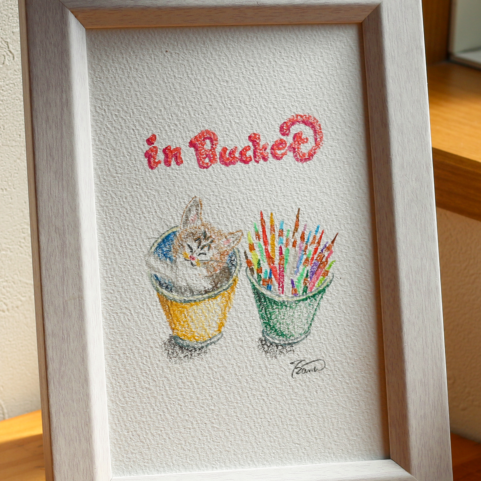 moguの色鉛筆画　バケツの中の子猫